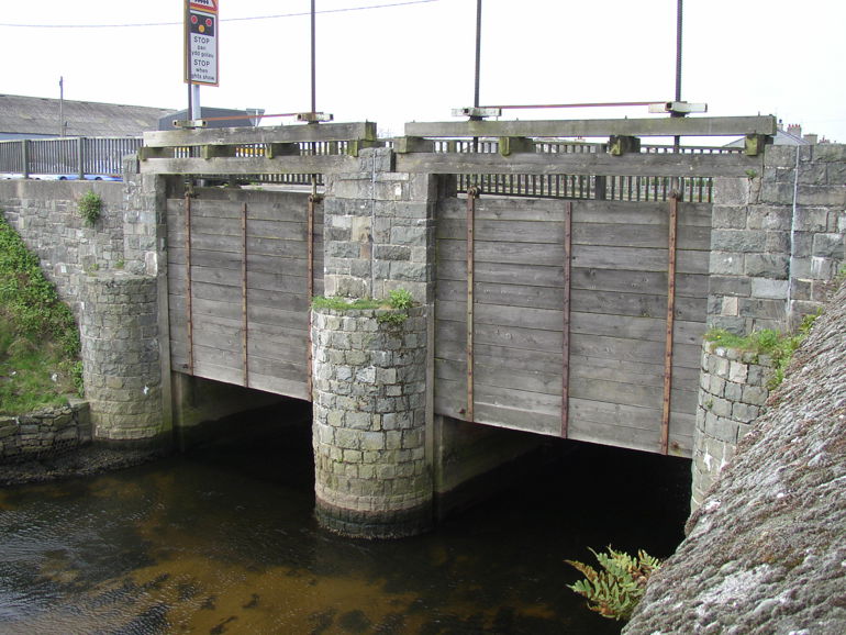 Penstocks on a bridge on the A497 road