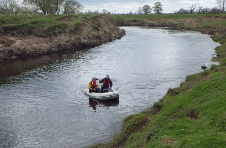 NRW officers investigating the pollution in the River Dee