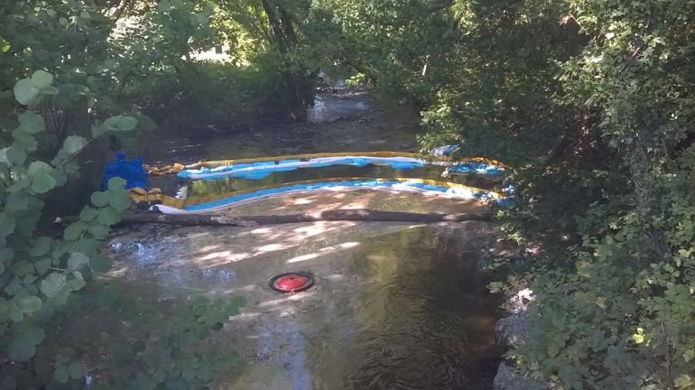 Oil spill in a river