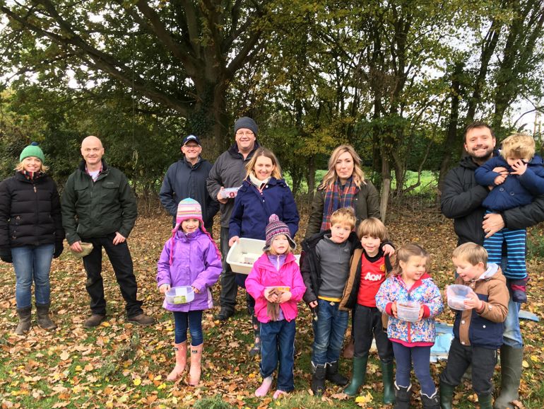 Volunteers collecting acorns