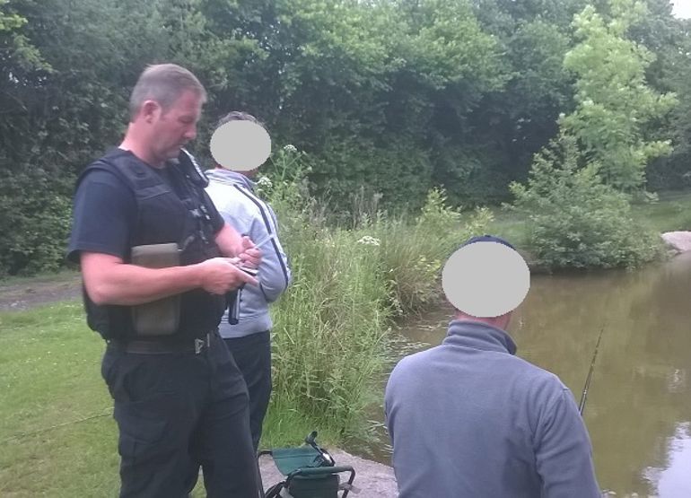 NRW enforcement officer checking rod licences