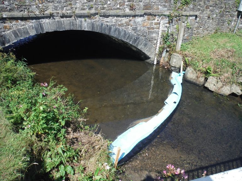 Image of a boom that has been deployed on the Tawelon Brook, near Johnstown in Carmarthenshire