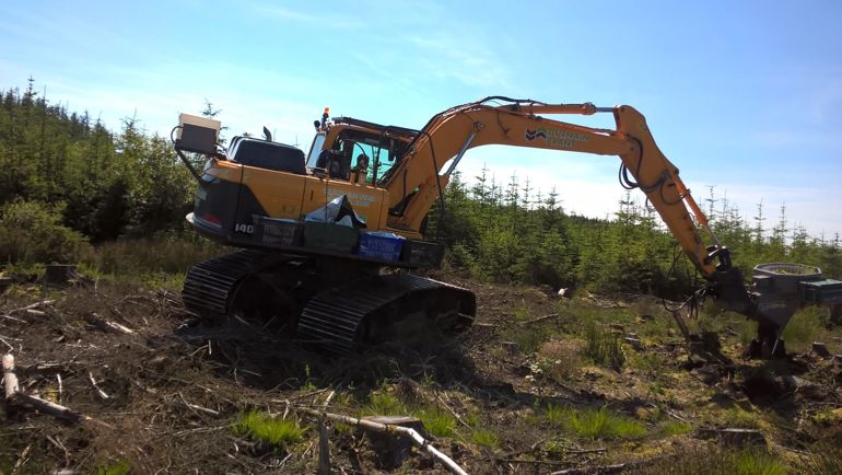 NRW using a mechanical planter Clocaenog and Tywi Forests