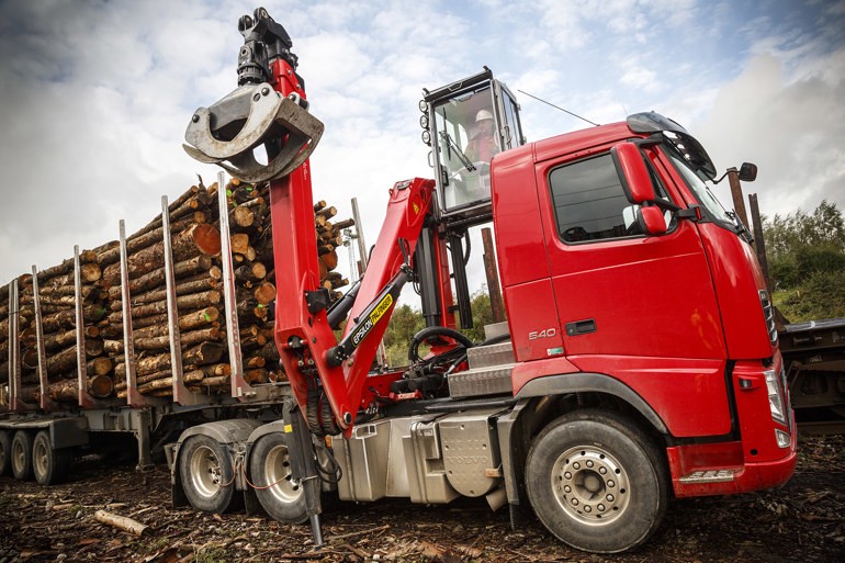 Red truck with timber