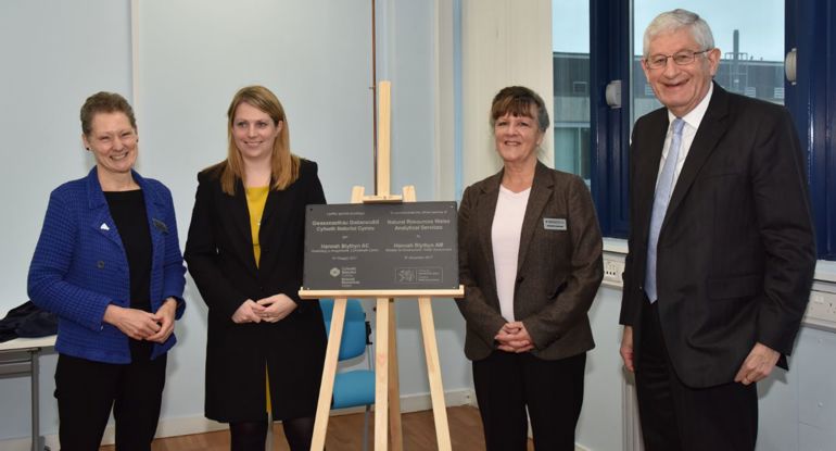 Photo of Dr Madeleine Havard, Hannah Blythyn, Dr Elizabeth Haywood and Prof Richard Davies around the opening plaque